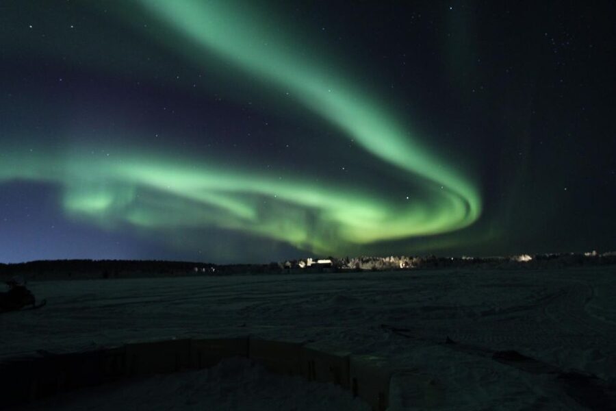 Aurora Hunt on Snowmobile - small groups - Fika by an open fire: the warm reset that makes the cold worth it
