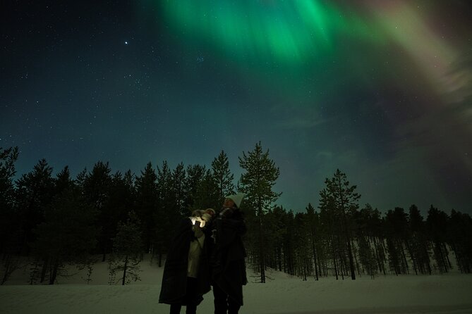 Aurora Hunting by Minivan in Ivalo, Inari or Saariselkä - Stop 2 Warm Hut Time: Sausages and Hot Berry Drinks