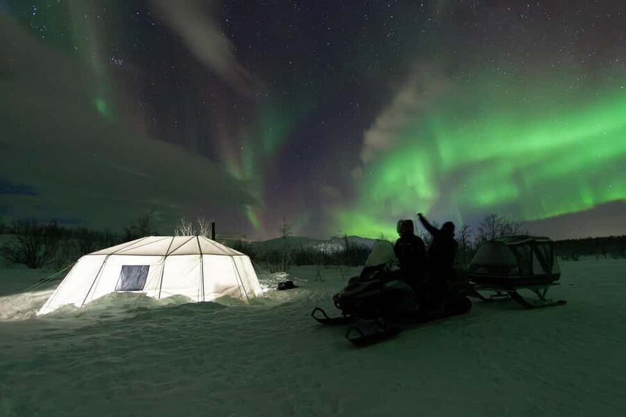 Aurora Snowmobile Sled Tour - The campfire pause: Warm drinks while the sky does its thing