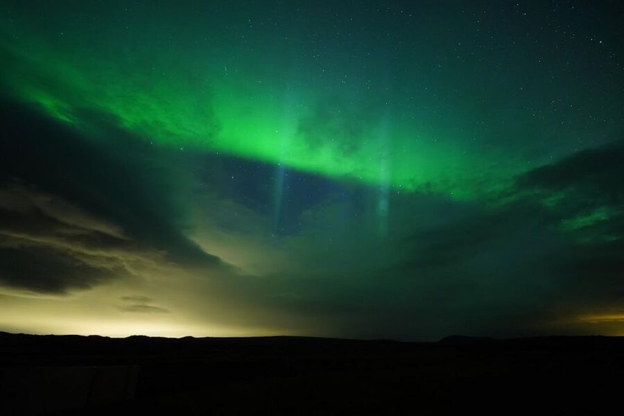 From Reykjavik: Northern Lights Tour with Hot Cocoa & Photos - Cozy aurora hunting from Reykjavik in a small minibus