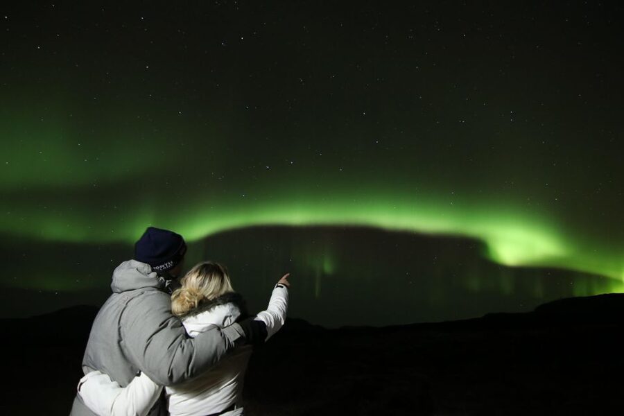From Reykjavik: Northern Lights Tour with Hot Cocoa & Photos - The secret stop and photo moments: how the viewing part really plays out