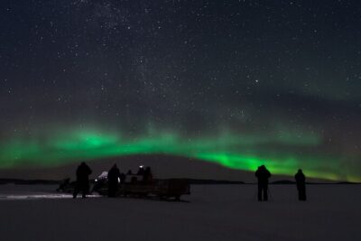 Northern lights tour to Lake Inari from Ivalo, Reindeers & Dinner - The Snowmobile-Pulled Sleigh Ride: Cozy Cold in Motion