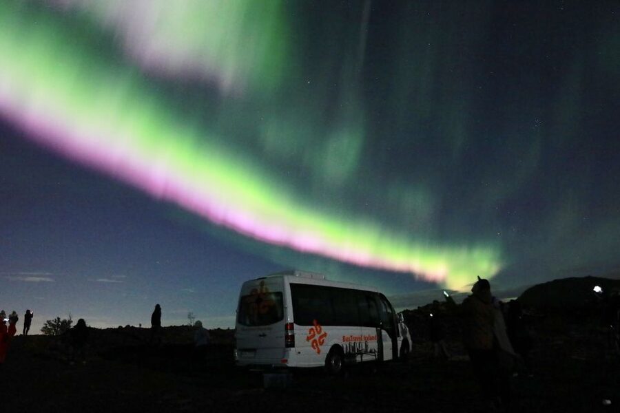 Reykjavik: Northern Lights Group Tour with Photos - Outside stops for photos: what you should do the moment you step out