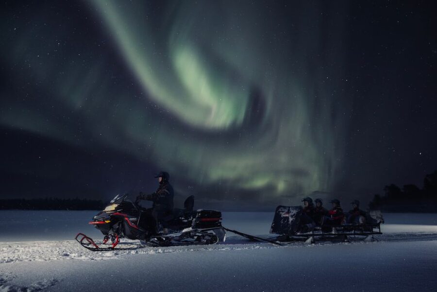 Ruka: Starlight sledging to search for Northern Lights - Riding the snowmobile sled: easy for families, fun for adults